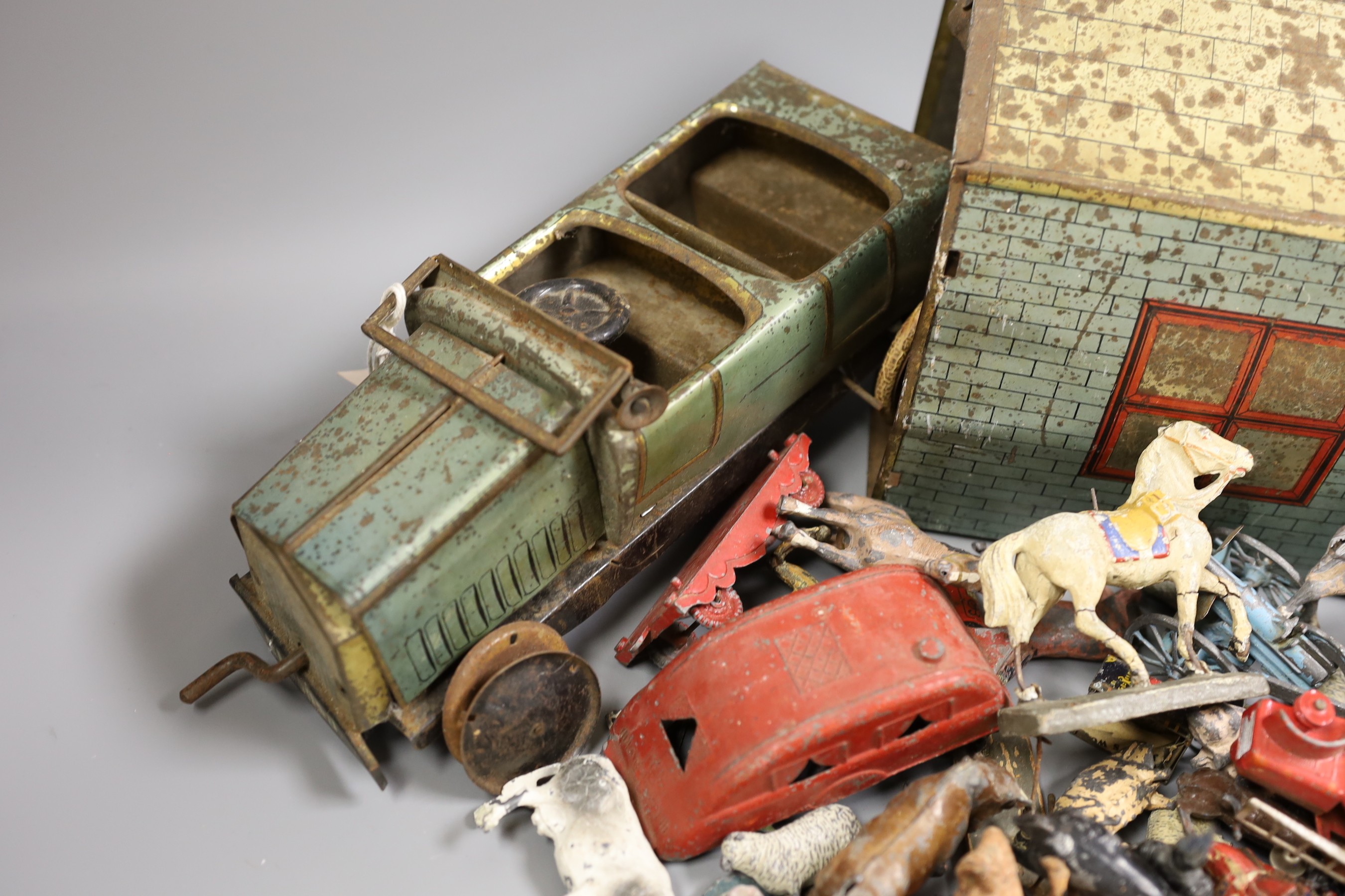 Brenco lithographed tinplate open tourer, and garage, and assorted hollow-cast toys, Elastolic, Dinky Toys, etc.
